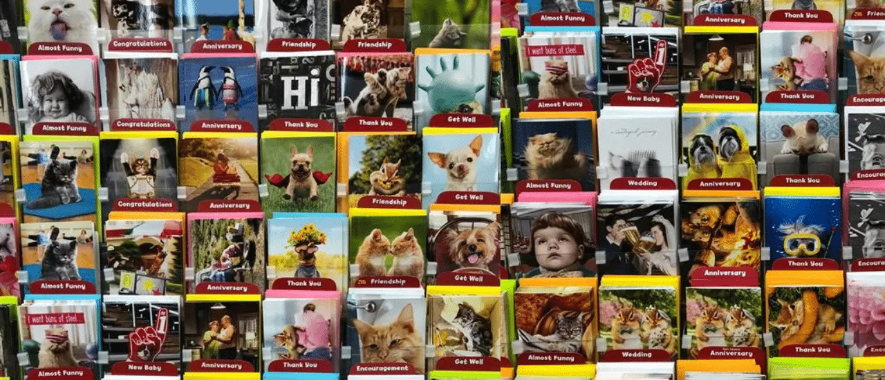 A full display of various greeting cards with colorful frames and diverse themes, symbolizing the wide range of targeting options and segmentation for direct mail campaigns.